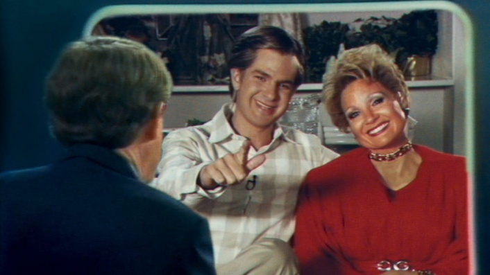 Jessica Chastain preaches on TV in The Eyes of Tammy Faye